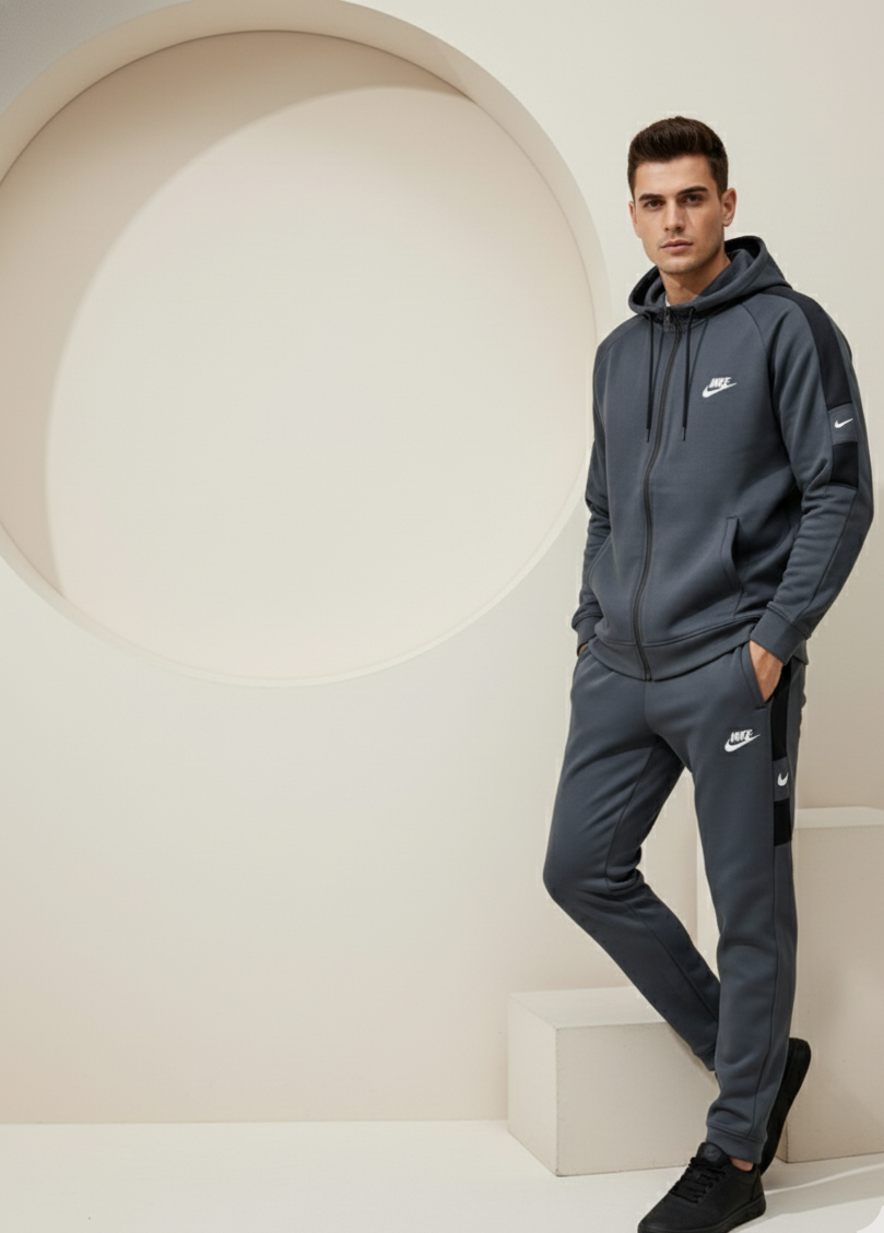 Nike Interlock Polyester Fleece Tracksuit Grey with black shoulder panels worn by model