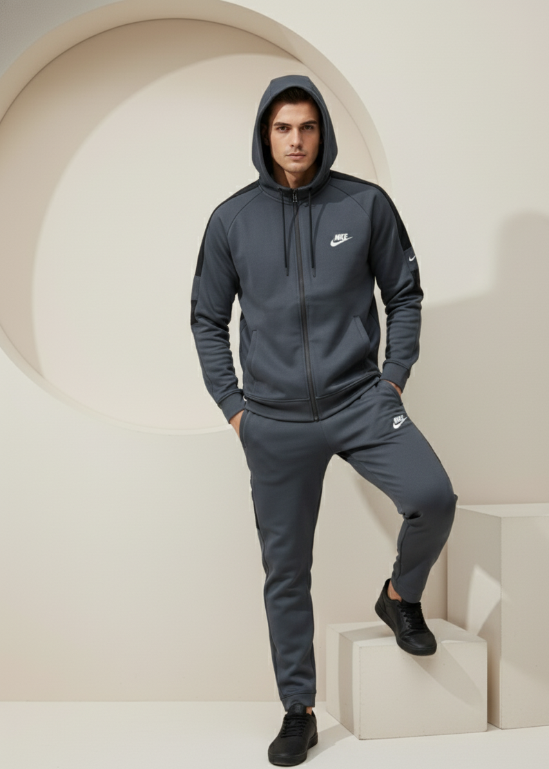 Nike Interlock Polyester Fleece Tracksuit Grey with black shoulder panels worn by model
