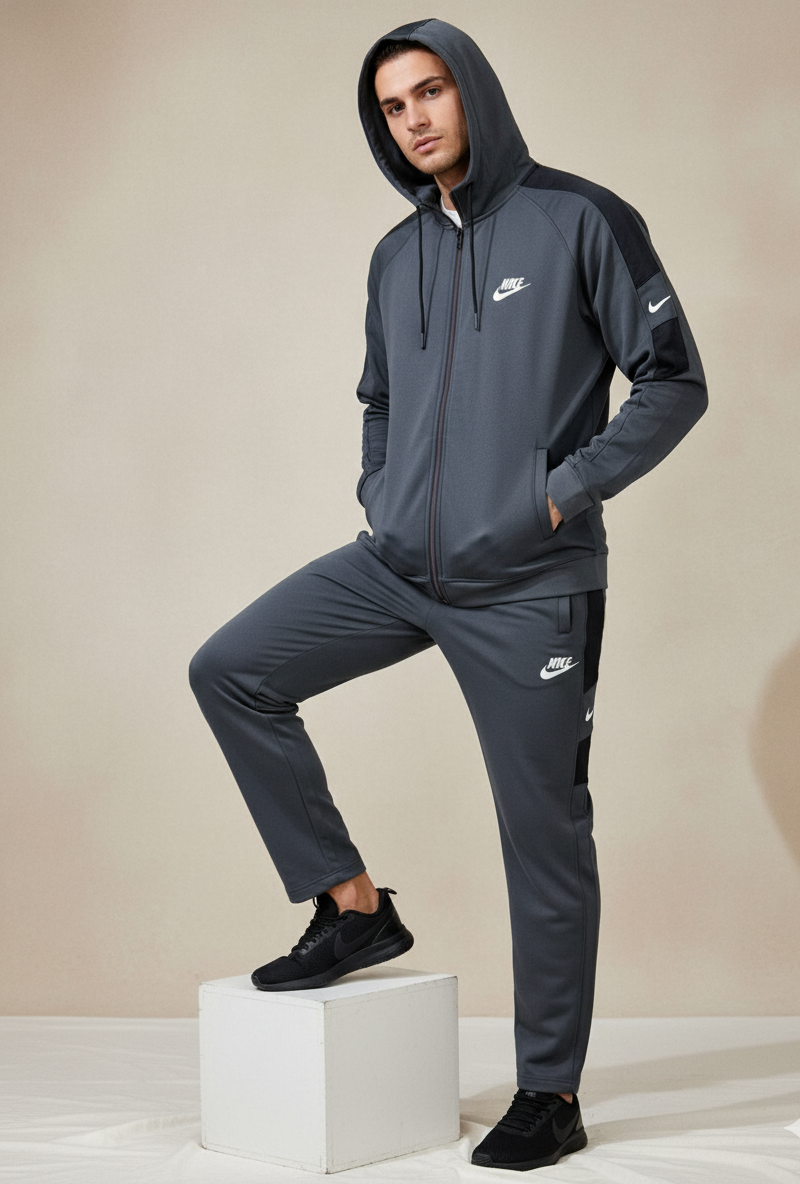 Nike Interlock Polyester Fleece Tracksuit Grey with black shoulder panels worn by model